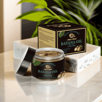 Anume Naturals Raw Batana Oil jar and box on marble surface for natural hair care and growth