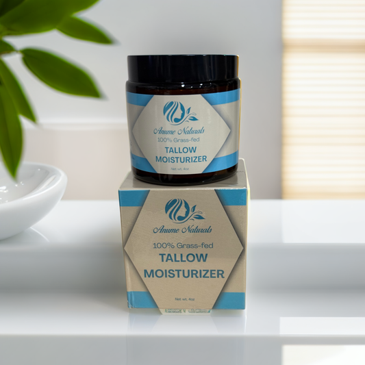 Anume Naturals Unscented Beef Tallow moisturizer jar and box on white surface with green plant background