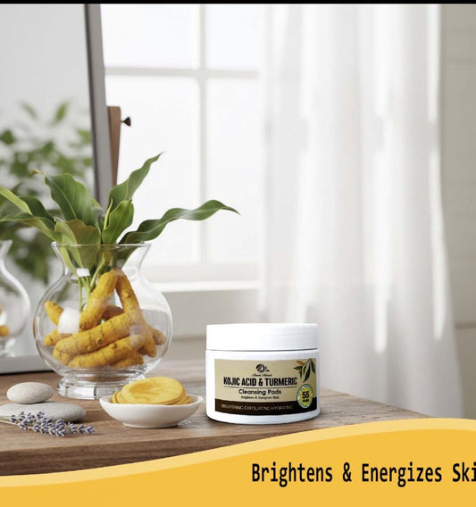 Anume Naturals Kojic Acid and Turmeric Radiance Cleansing Pads container on a wooden surface with turmeric roots and soap bar beside it in a bright, airy room