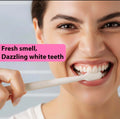 Woman brushing teeth with natural teeth whitening powder for fresh smell and dazzling white teeth